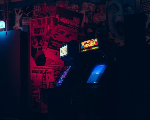 Smartphone displaying a fictional mobile game at an Australian gaming technology exhibition